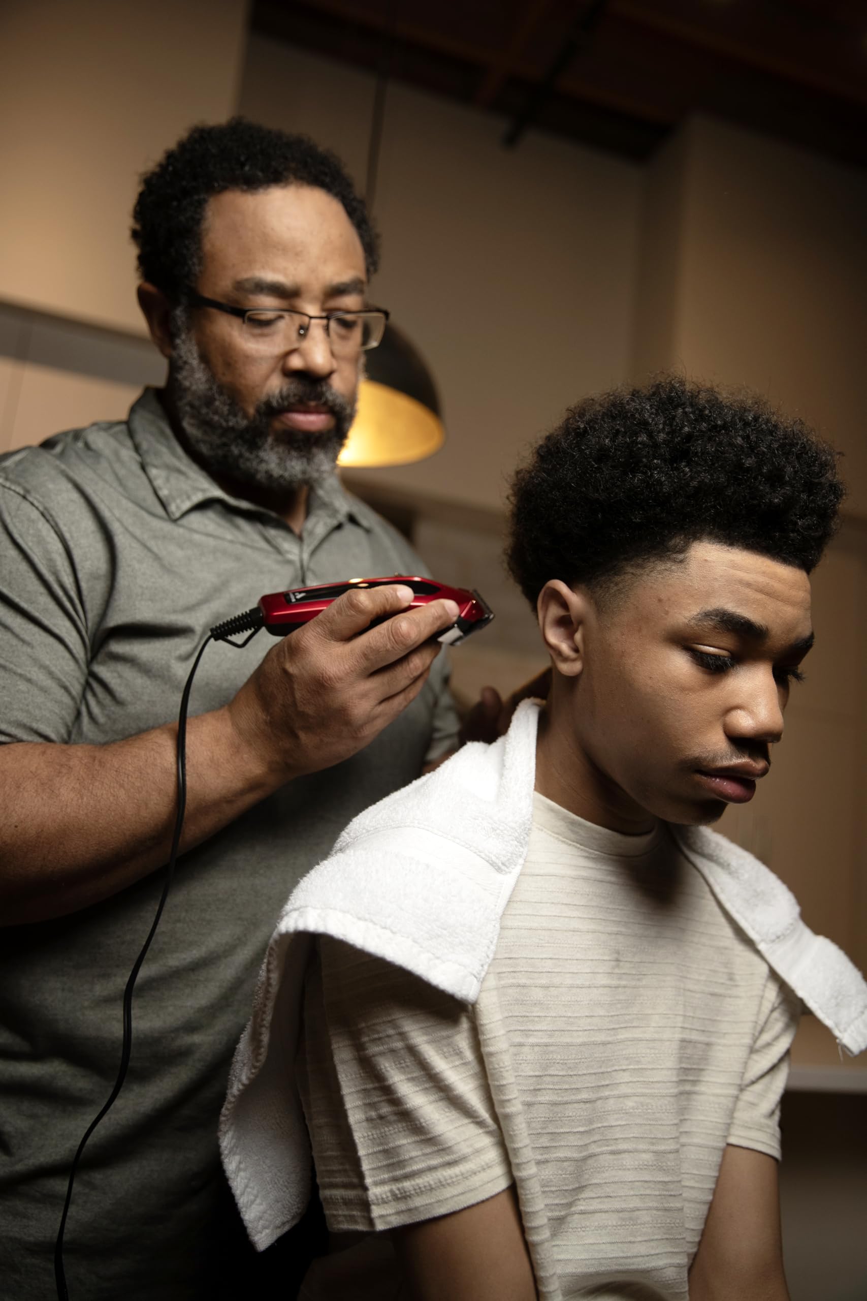 Black Andis 562940 Ultra Clip Corded Clipper & Trimmer 15-PieceHair Cutting Combo Kit, Stainless Steel Blades, Power Pivot Motor, Whisper Quiet, Hanger Loop, Red