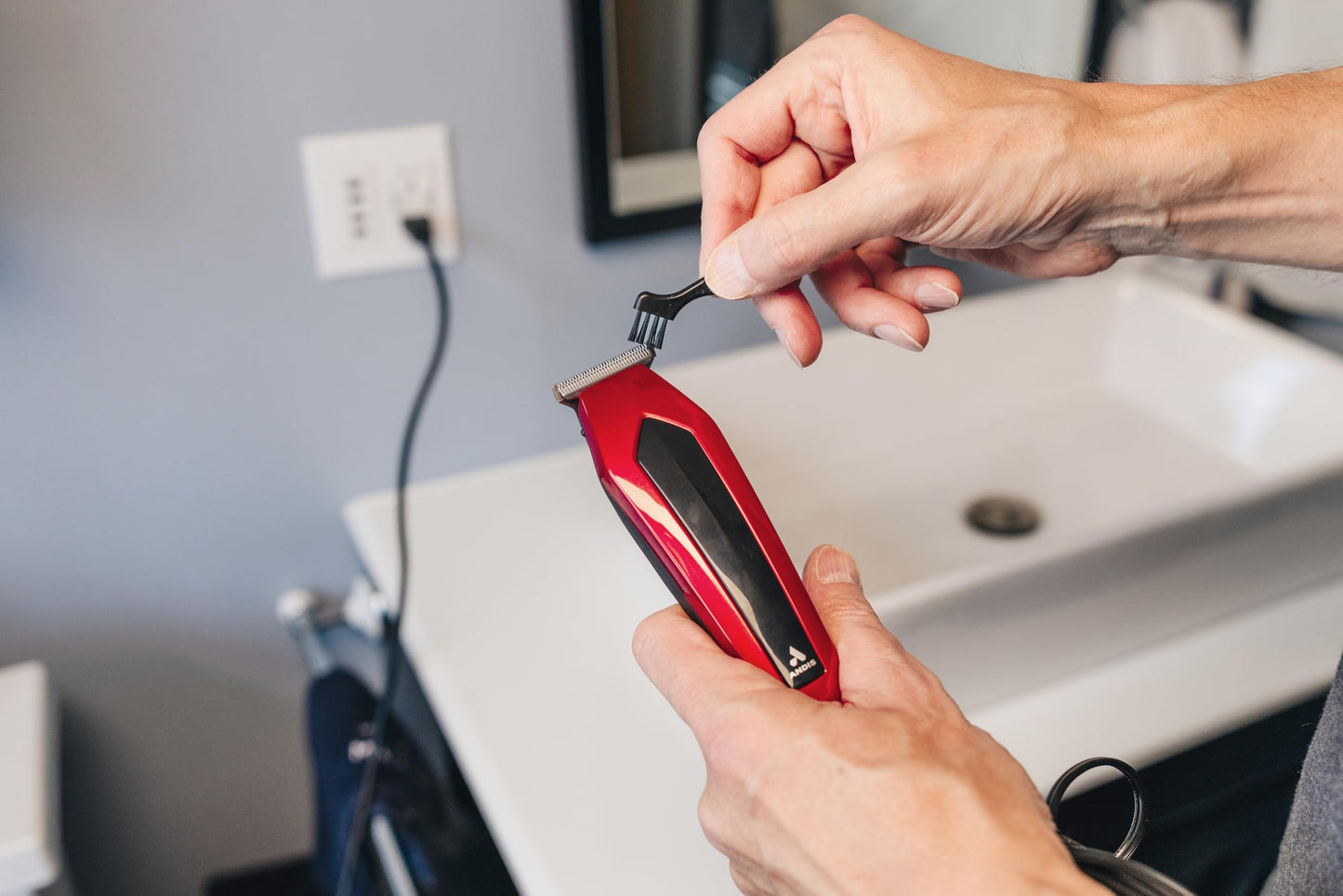 Dark Gray Andis 562940 Ultra Clip Corded Clipper & Trimmer 15-PieceHair Cutting Combo Kit, Stainless Steel Blades, Power Pivot Motor, Whisper Quiet, Hanger Loop, Red