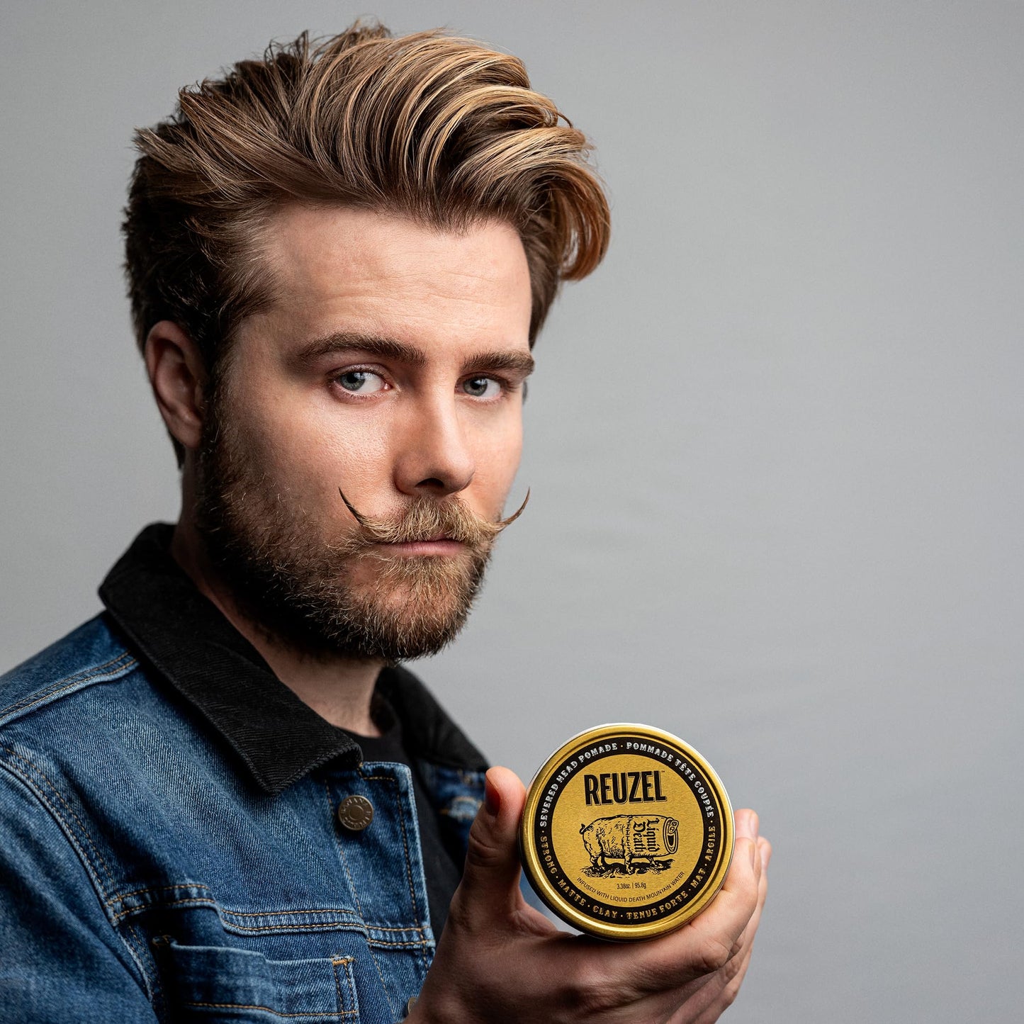 Gray REUZEL and Liquid Death Severed Head Matte Clay Pomade, Strong All Day Hold, Water Soluble, Matte Finish and Non-Greasy Formula, Easy To Wash Out, For All Hair Types, 3.38 oz