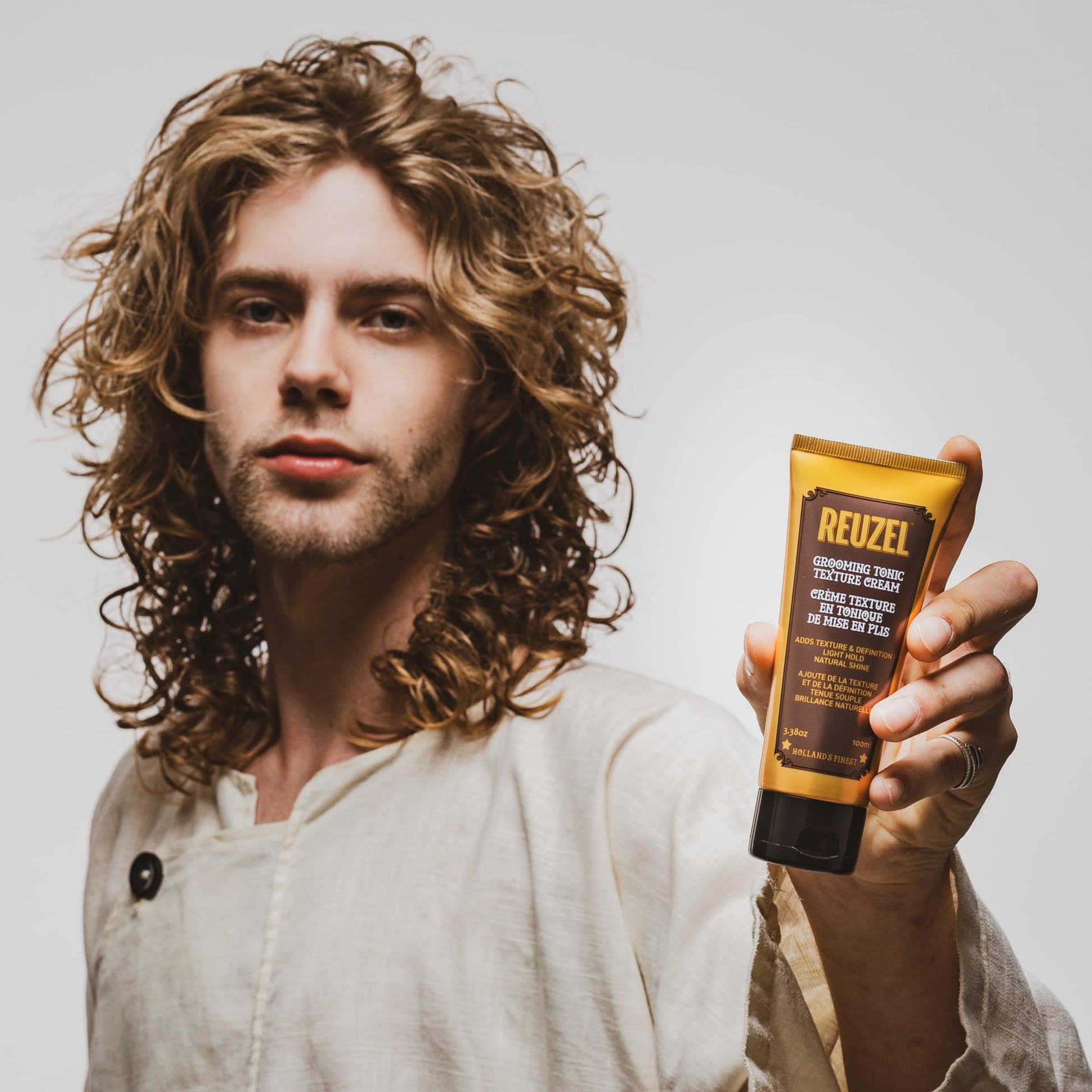 Gray REUZEL Grooming Tonic Texture Cream, Light Hold, Curl Texture and Definition, Natural Shine, Heat Protection, For All Hair Types, 3.38oz